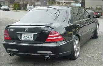 A black Mercedes after repair.