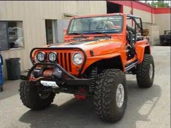 Orange Jeep after repair.